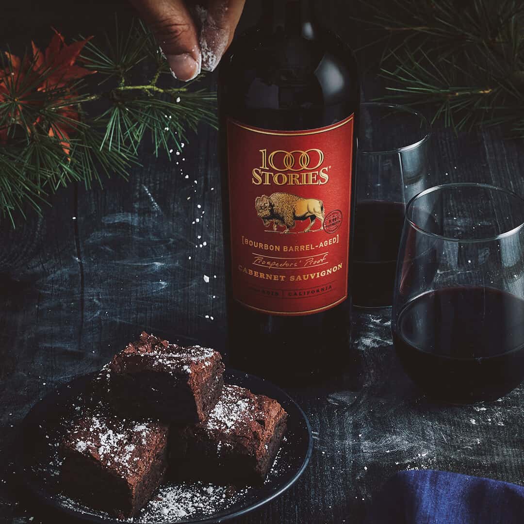 Holiday table setting with delicious brownies and 1000 Stories wine